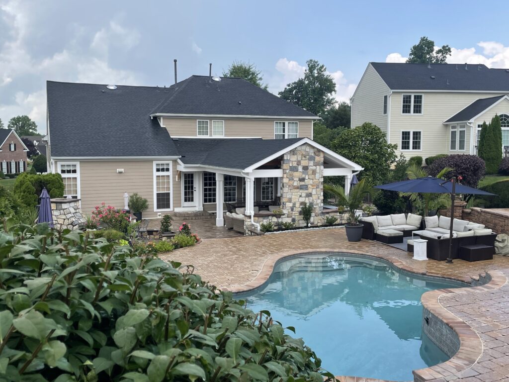 Patio with pool covered seating area from CKC landscaping