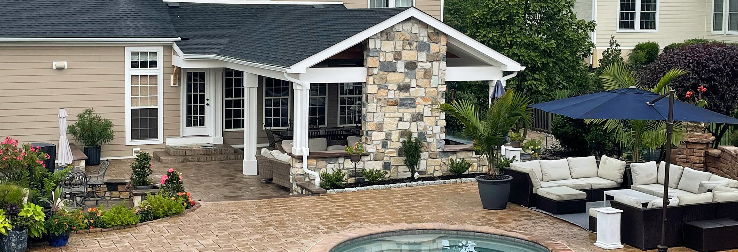 backyard with pool and two seating areas from CKC Landscaping