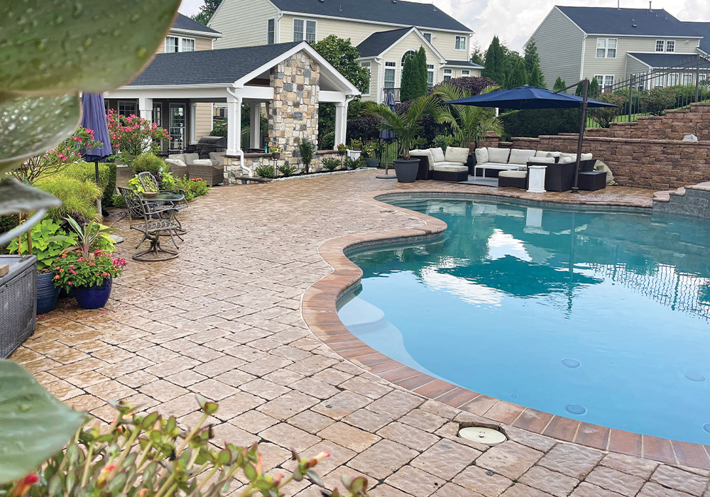 backyard patio with pool and seating from CKC Landscaping